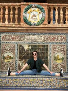 Young woman sitting in Seville's Plaza de España